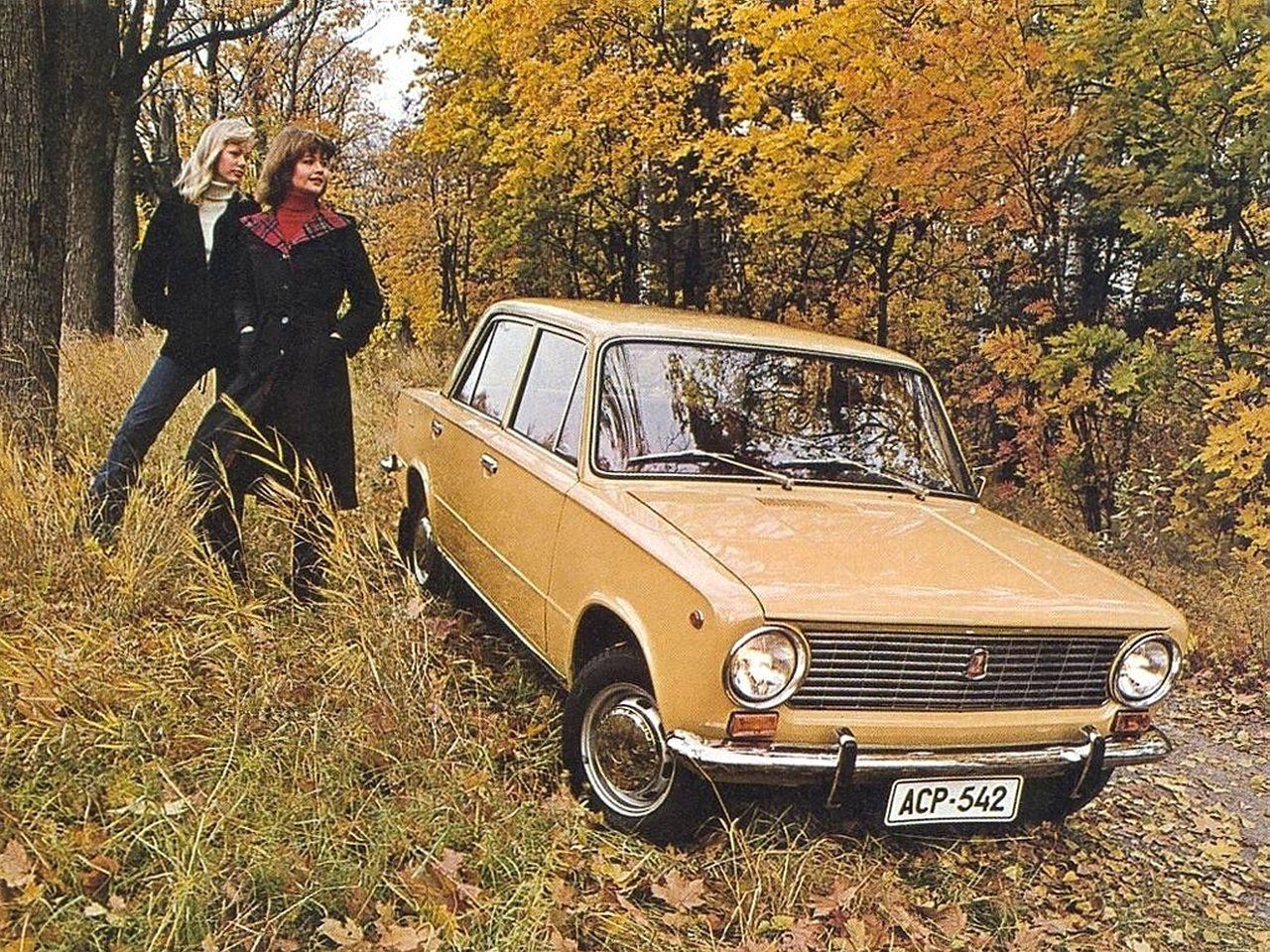 Two girls and a yellow Zhiguli.