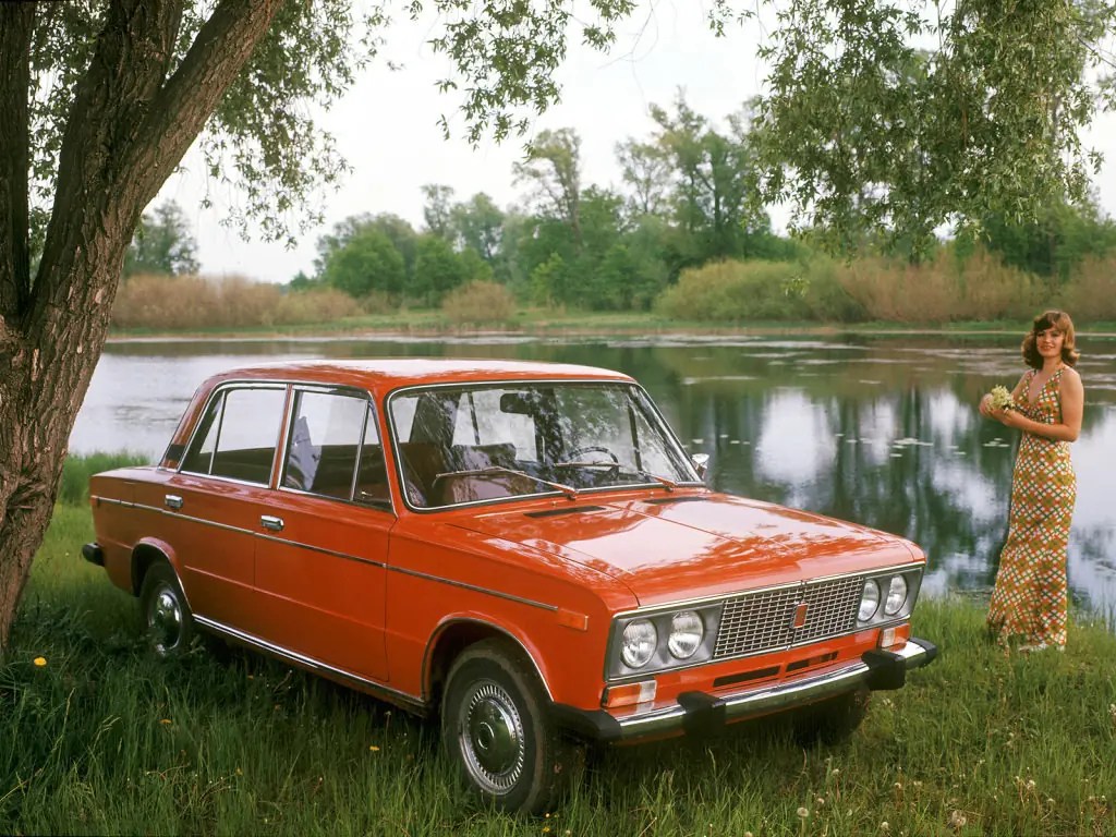 A girl and an orange Lada.