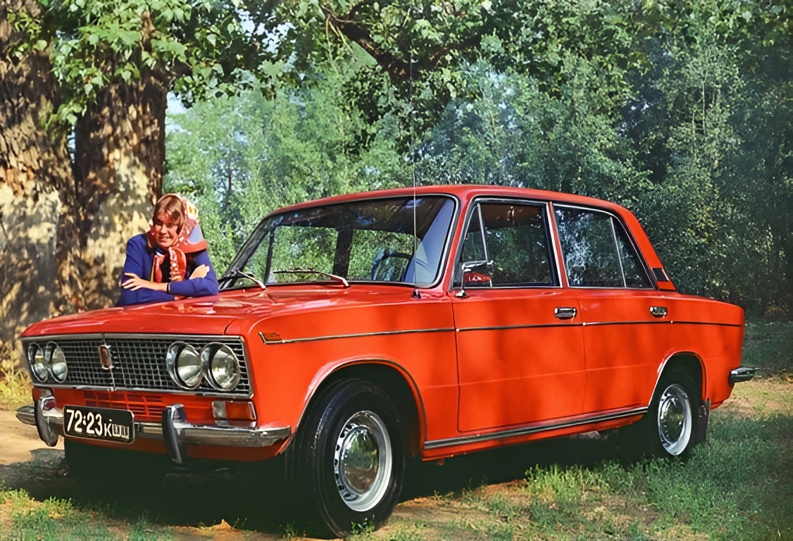 A girl and an orange Lada.