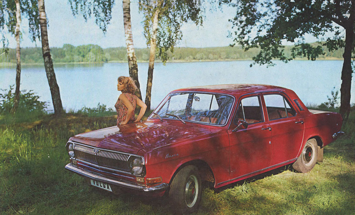 A girl and a red Volga GAZ M-24.