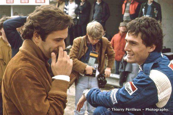 Riccardo Patrese and Elio de Angelis, sit on the tyres of the new