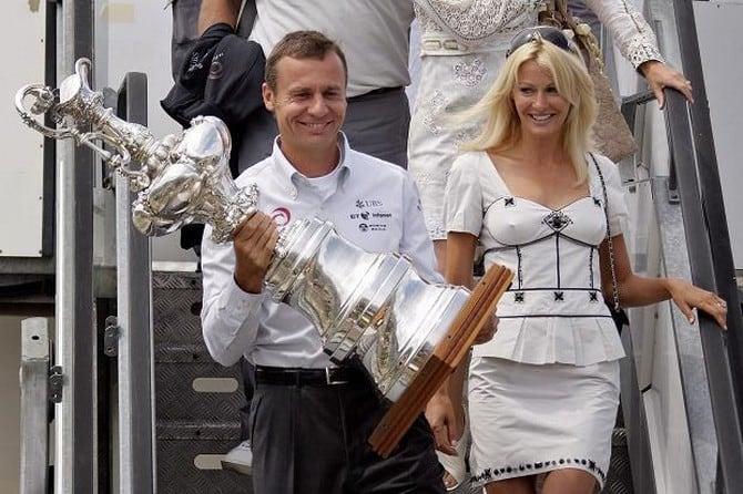Ernesto and Kirsty getting off the plane with the America's Cup.