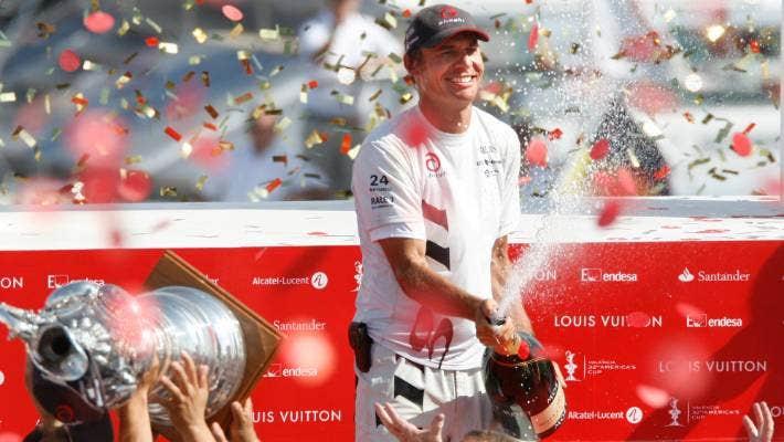 Ernesto Bertarelli sprays the victory champagne after his Alinghi team beat Emirates Team New Zealand to win the 2007 America's Cup in Valencia.