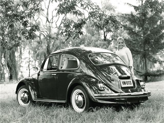 A woman and a Volkswagen Beetle 1200.