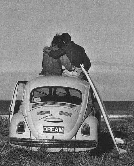 A couple on a Beetle.