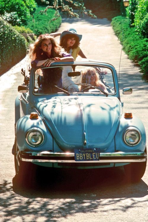 Three girls in a Beetle.