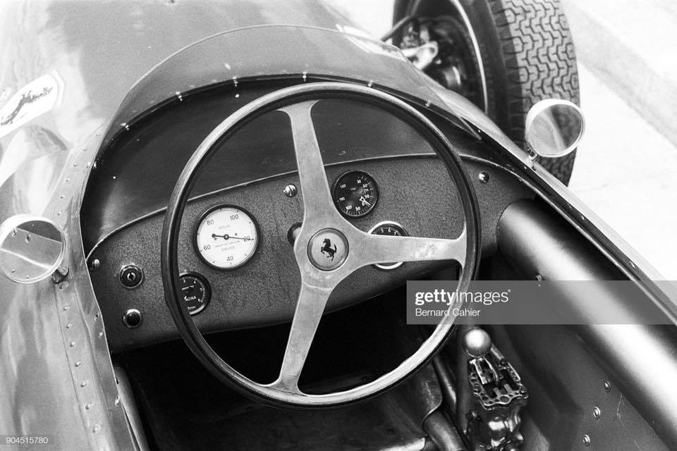 The cockpit of a vintage Ferrari.