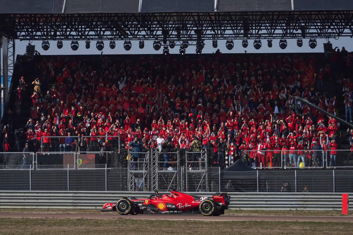 Charles Leclerc driving the new Ferrari in front of the fans.