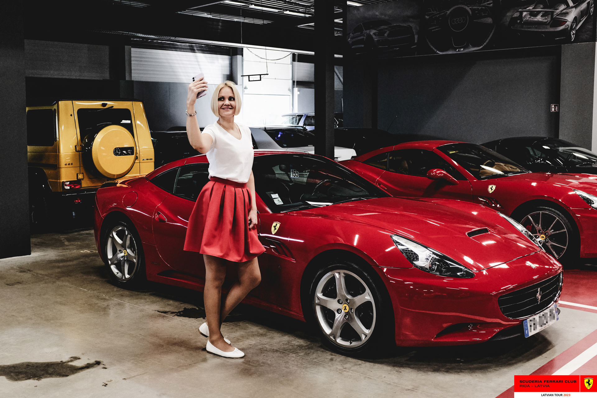 An SFC Riga grid girl and Ferraris in Stuttgart’s garage.