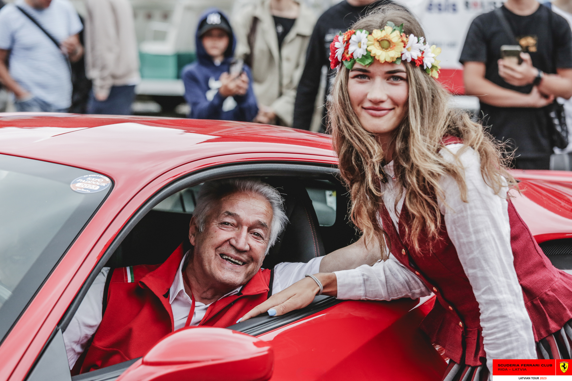 A grid girl with one of the Ferrari owners.