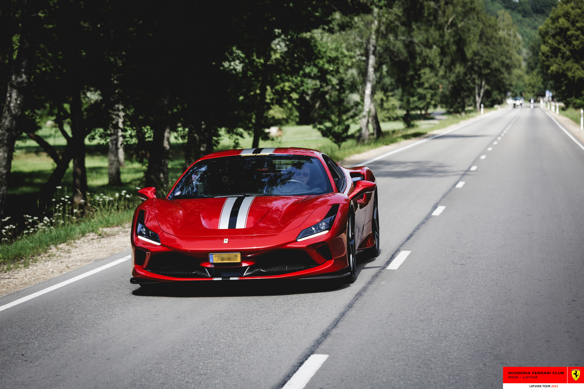 A red Ferrari en route to Cesis.