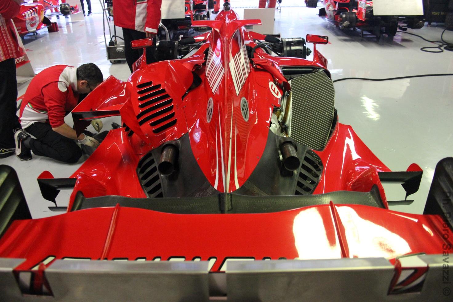 Photo of a red Ferrari in a factory