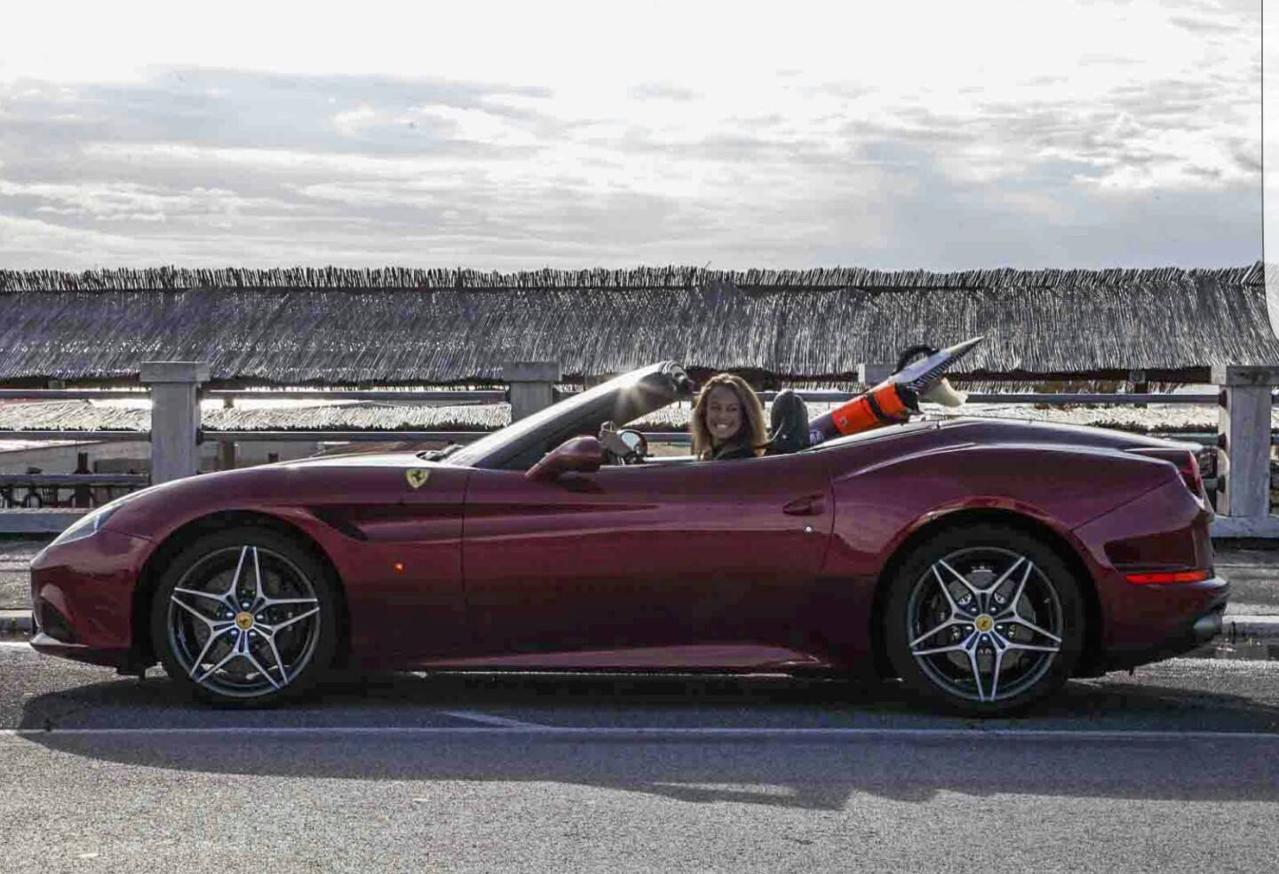 Flavia Tartaglini in a Ferrari California T.