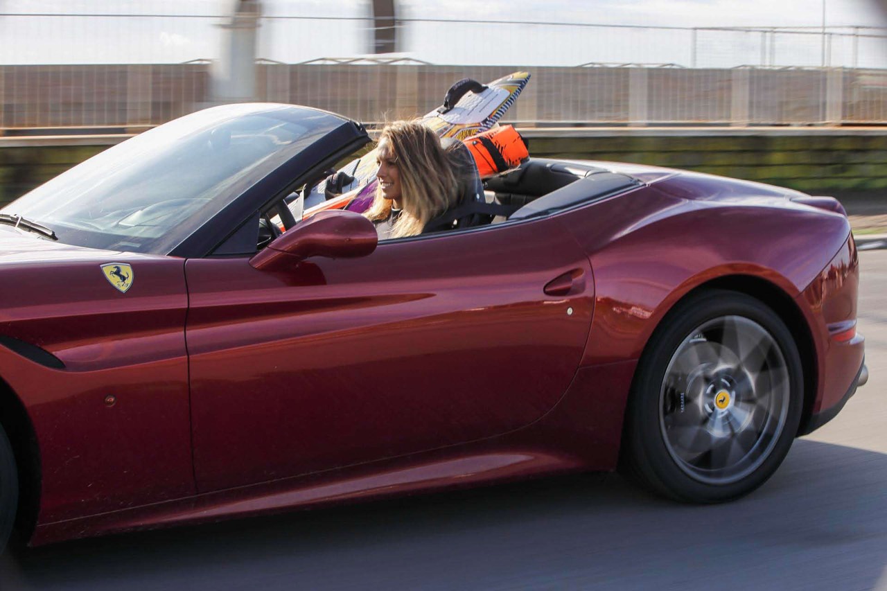 Flavia Tartaglini in a Ferrari California T.