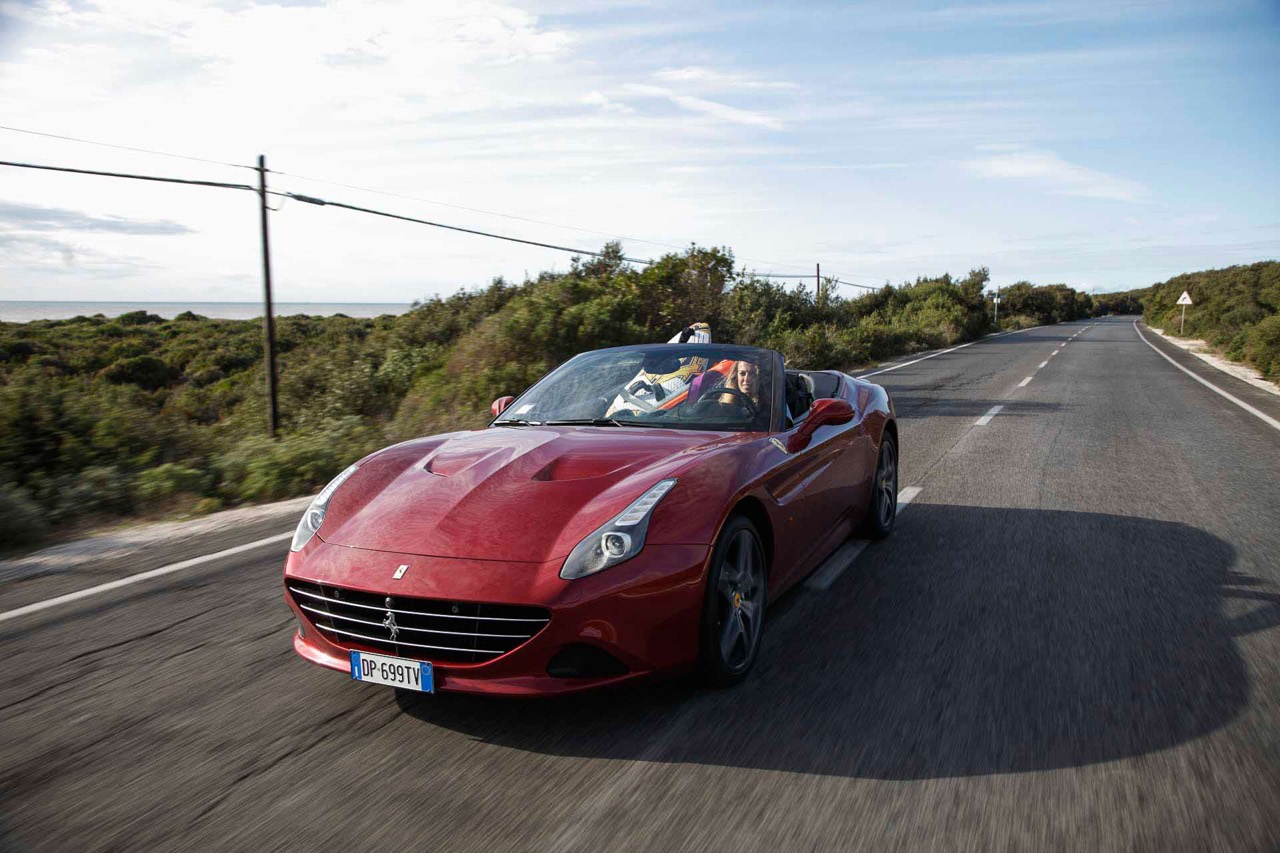 Flavia Tartaglini in a Ferrari California T.