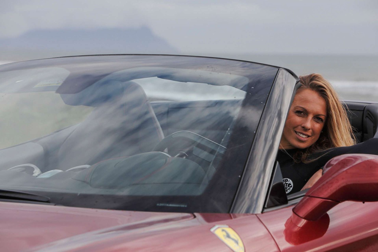 Flavia Tartaglini in a Ferrari California T.