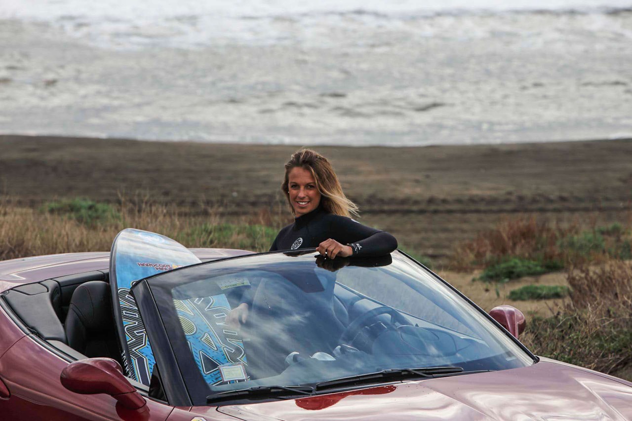 Flavia Tartaglini in a Ferrari California T.