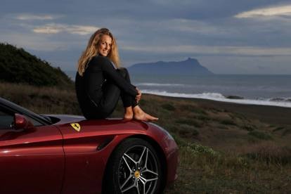 Flavia Tartaglini on a Ferrari California T.