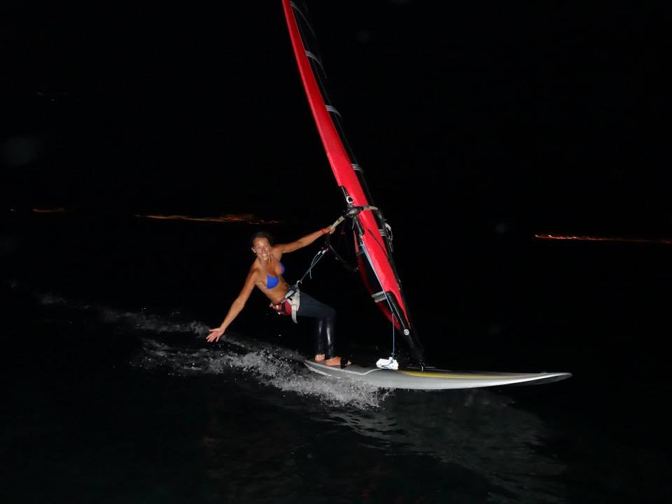 Flavia Tartaglini on a windsurf at night in August 2013.