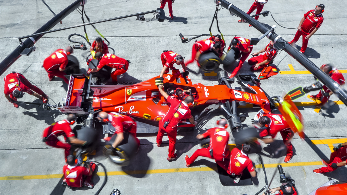Team members of Kimi Raikkonen of Scuderia Ferrari practice a pit stop ahead of the Malaysia Formula One Grand Prix at Sepang on 30 September 2017.