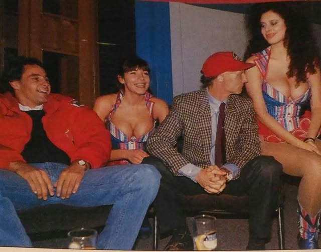Gerhard Berger with Niki Lauda and two women.