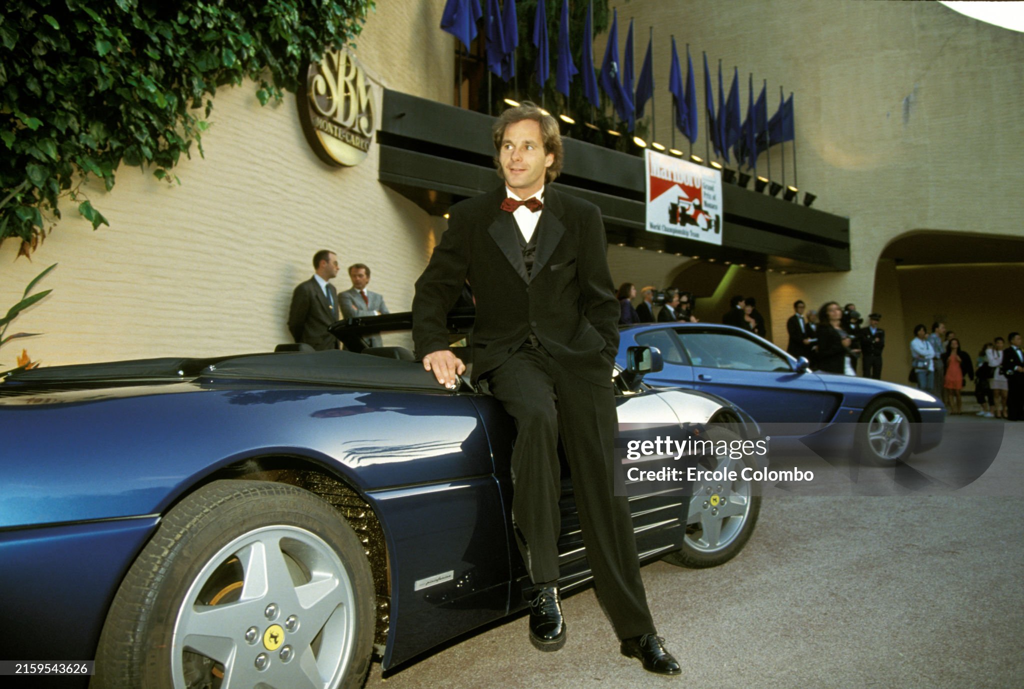 Gerhard Berger and a blue road Ferrari at the Monaco Grand Prix in Monte Carlo on May 23, 1993. 
