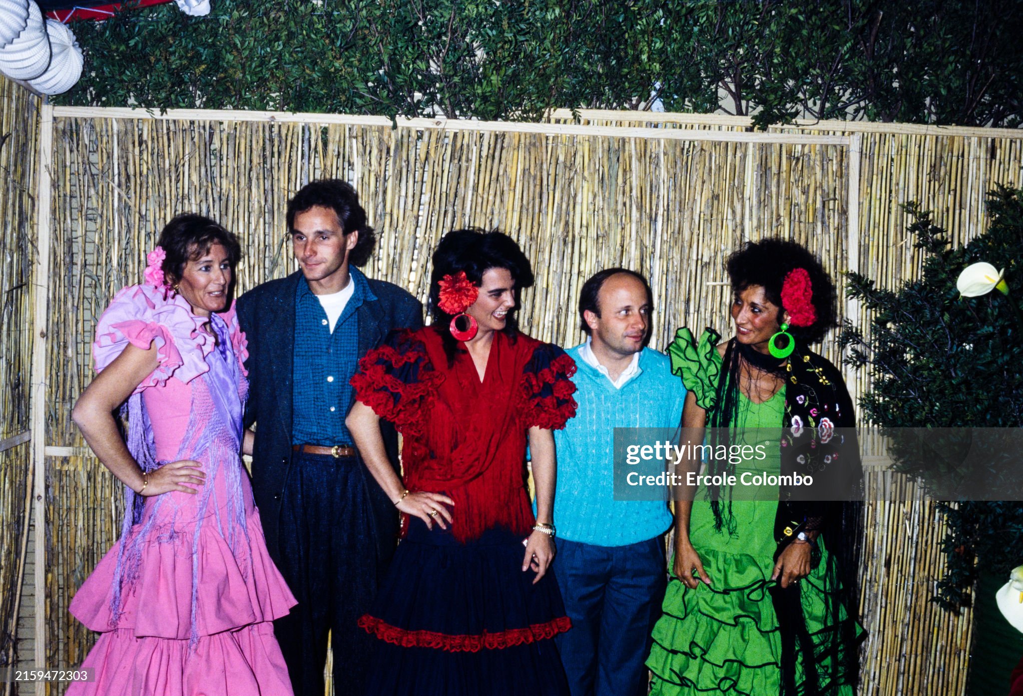 Gerhard Berger and Teo Fabi with women in traditional clothing during the Spanish Grand Prix at Jerez on April 13, 1986. 