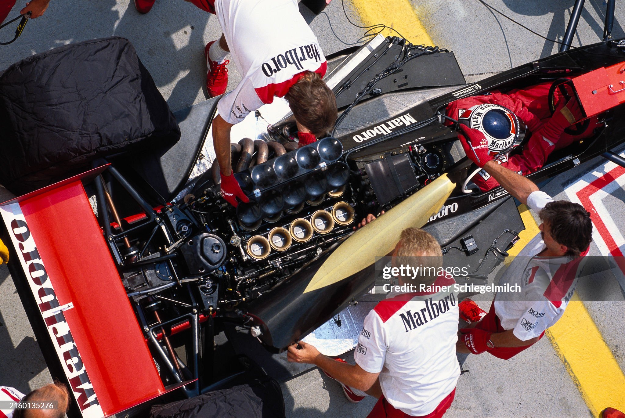 Mechanics work on Gerhard Berger's McLaren MP4-5B Honda during the Hungarian Grand Prix at Hungaroring on 29 July 2005. 
