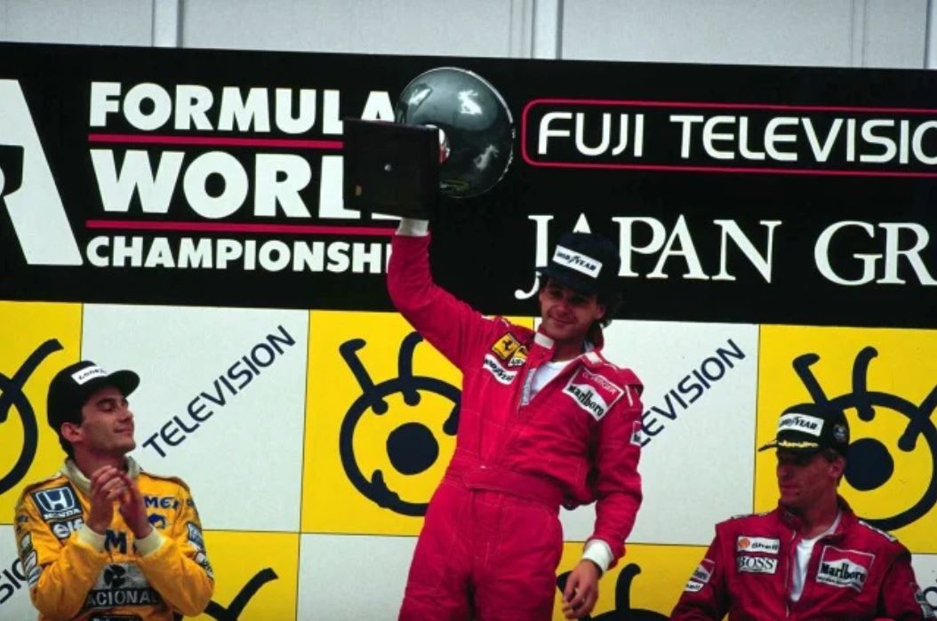 Gerhard Berger on the top step of the podium in Japan in 1987.