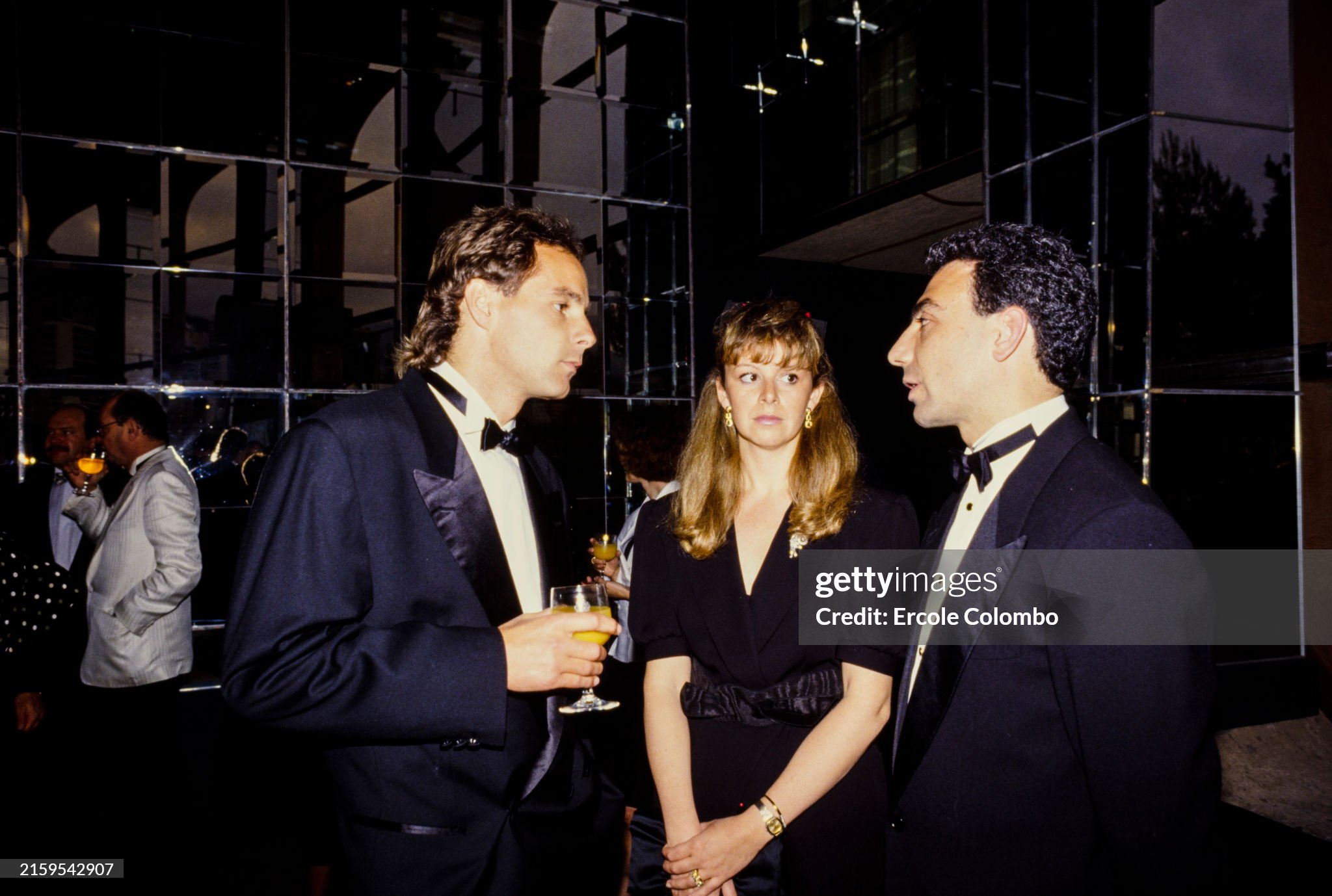 Gerhard Berger, Michele Alboreto and Alboreto's wife Nadia at the Monaco Grand Prix in Monte Carlo on May 15, 1988. 