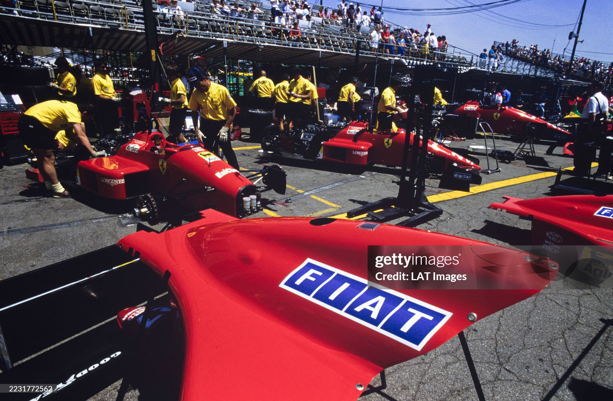 The Ferrari F187-88C cars of Michele Alboreto and Gerhard Berger are worked on in the pit lane during the Detroit Grand Prix on 19 June 1988. 
