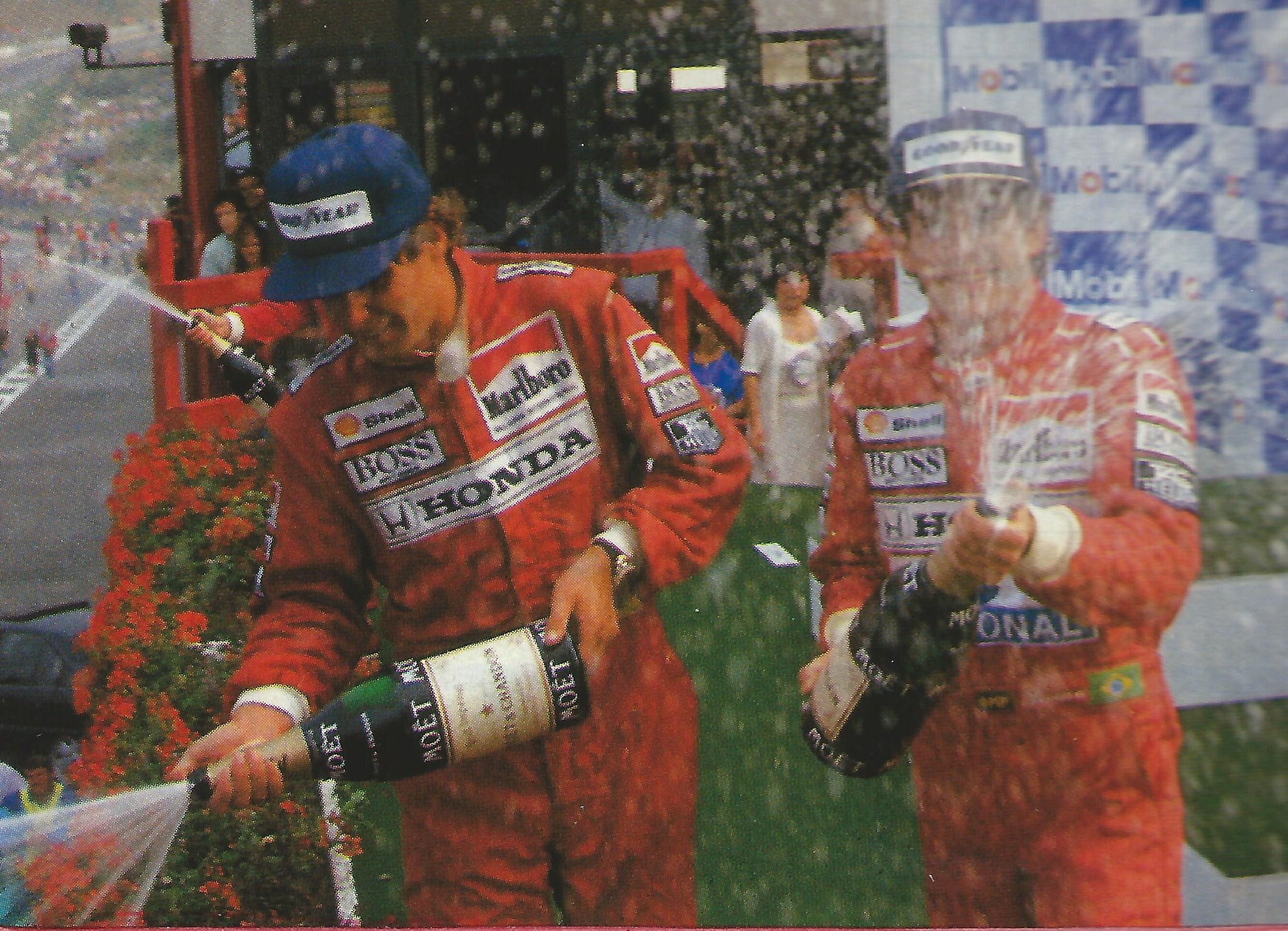 Gerhard Berger and Ayrton Senna spray champagne at the end of the 1990 Belgian Grand Prix.