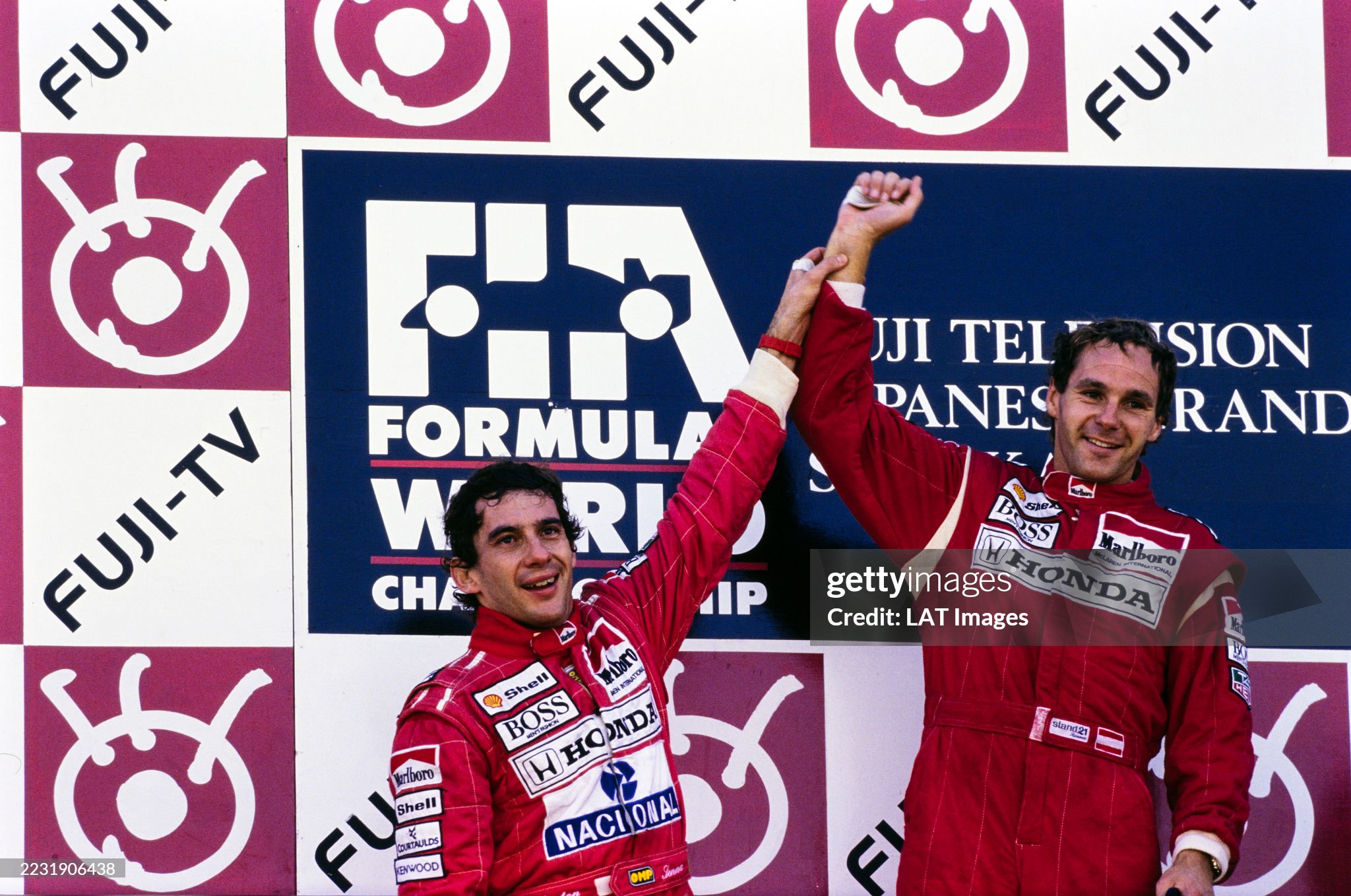 Gerhard Berger, 1st position, celebrates on the podium with Ayrton Senna, 2nd position, at the Japanese Grand Prix in Suzuka on 20 October 1991. 