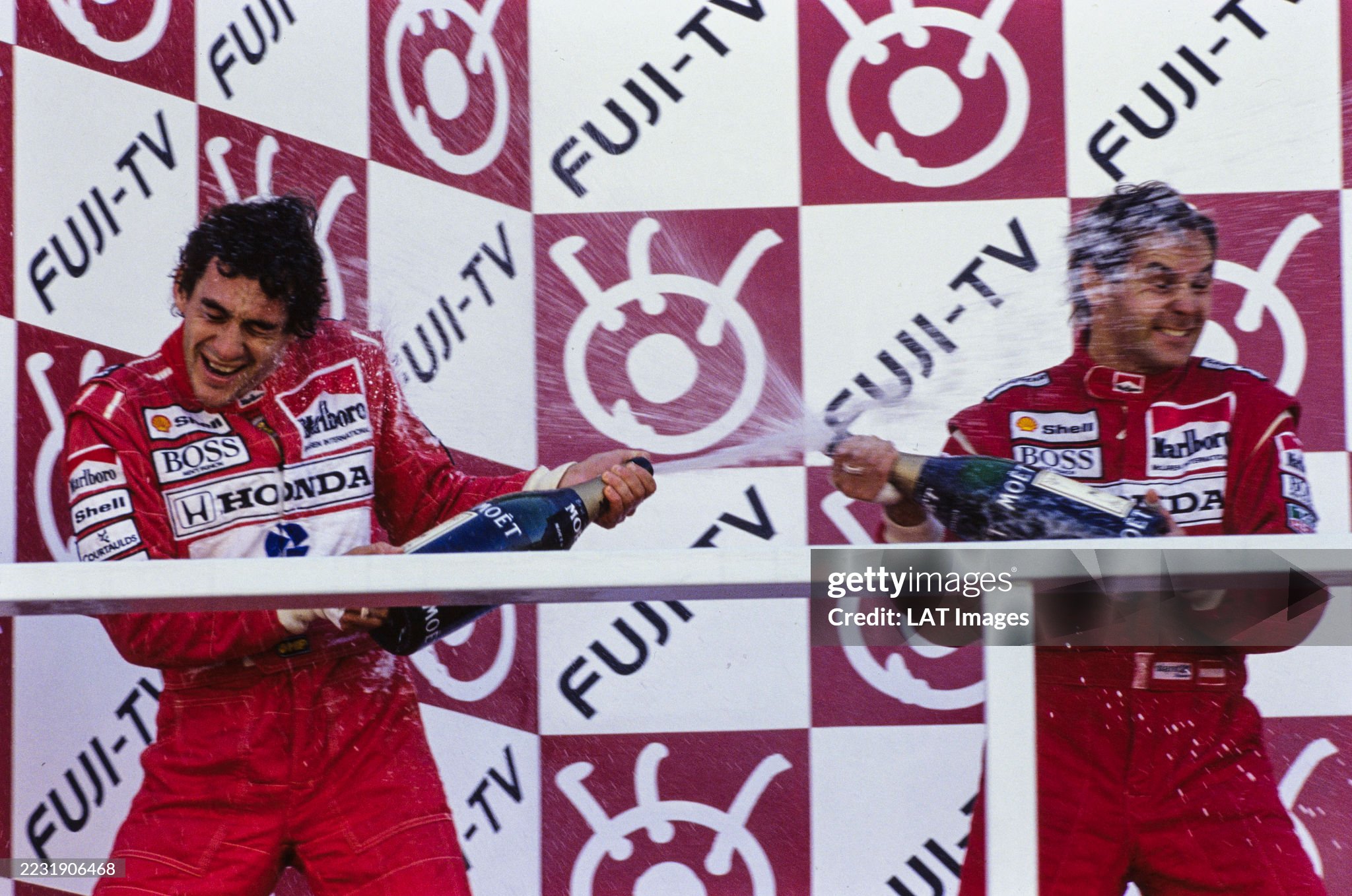 Ayrton Senna, 2nd position and Gerhard Berger, 1st position, spray champagne on the podium at the Japanese Grand Prix in Suzuka on 20 October 1991. 