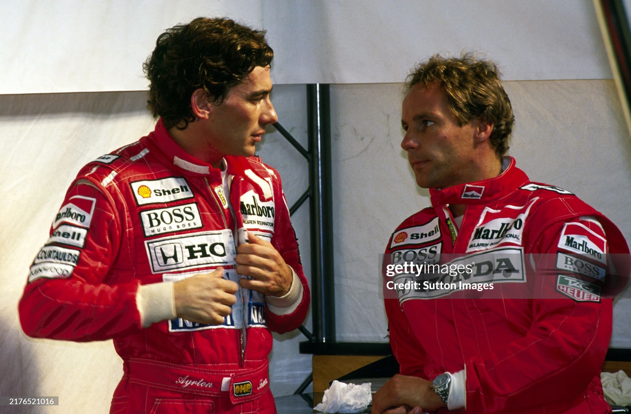 Fifth placed Ayrton Senna talks with his McLaren team mate Gerhard Berger, who retired from the race on the opening lap with a transmission failure, at the Belgian Grand Prix in Spa-Francorchamps on 30 August 1992. 