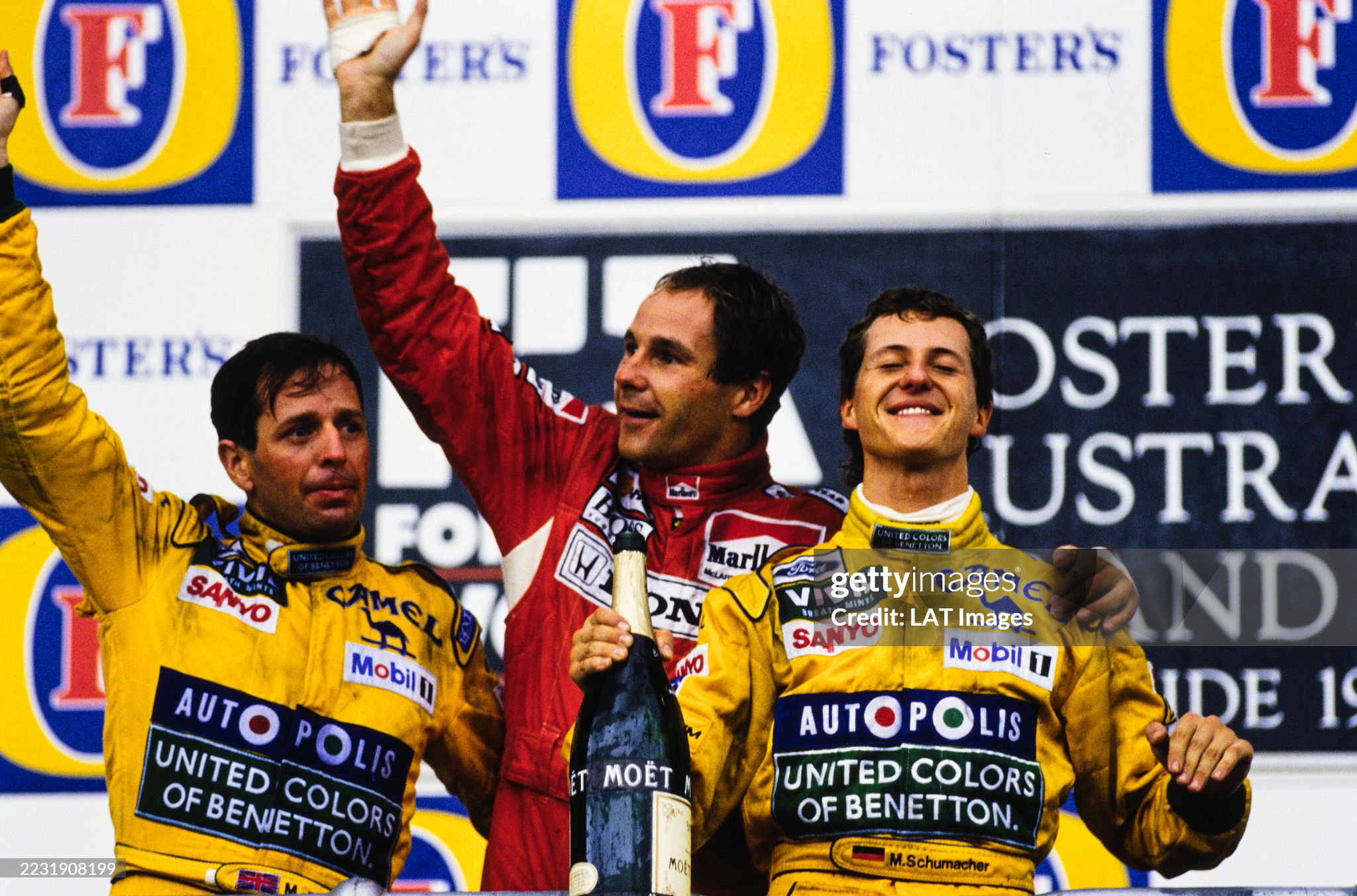 Martin Brundle, 3rd position, Gerhard Berger, 1st position and Michael Schumacher, 2nd position, on the podium of the Australian Grand Prix at Adelaide Street Circuit on 08 November 1992.