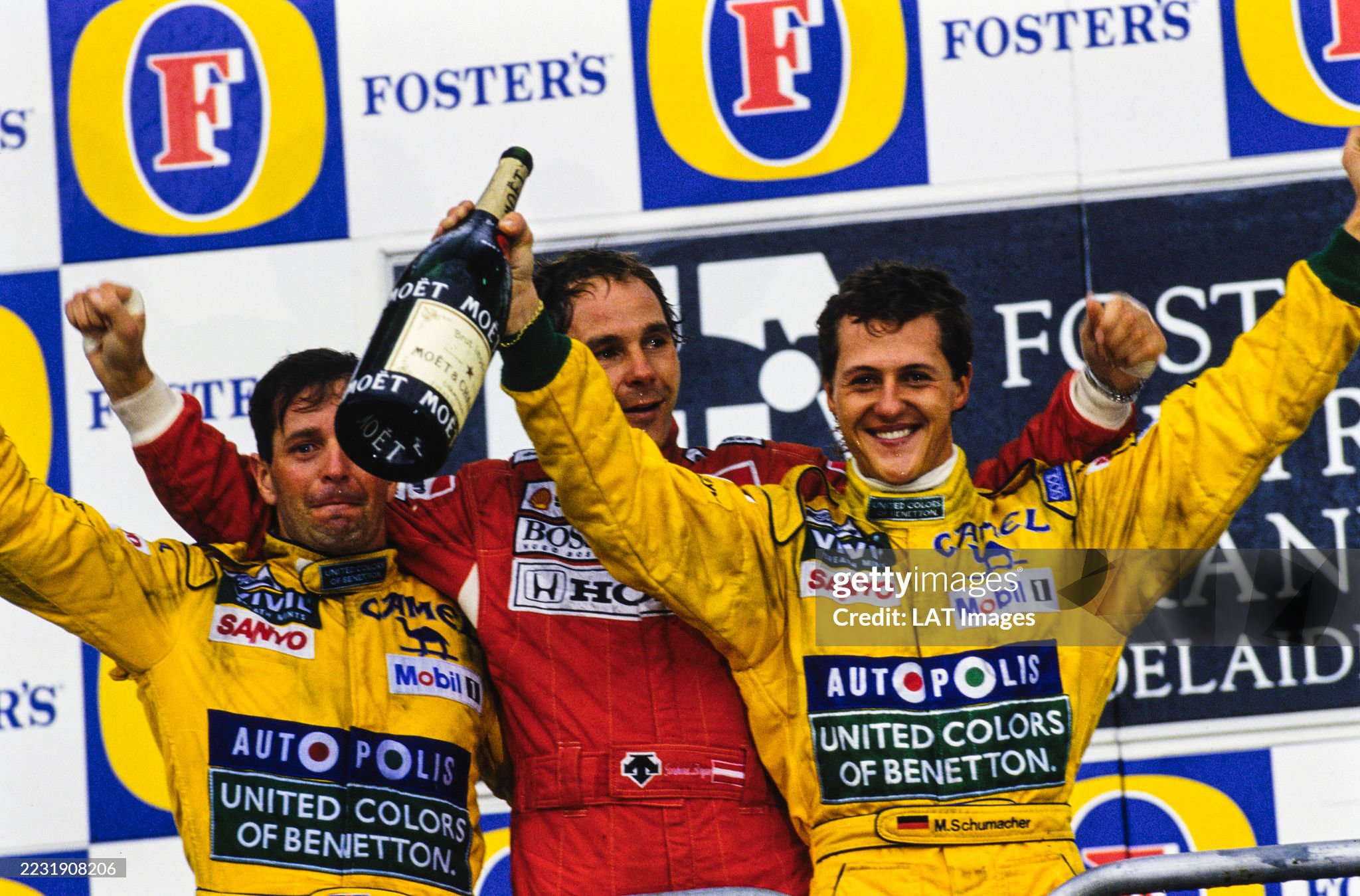 Martin Brundle, 3rd position, Gerhard Berger, 1st position and Michael Schumacher, 2nd position, on the podium of the Australian Grand Prix at Adelaide Street Circuit on 08 November 1992.