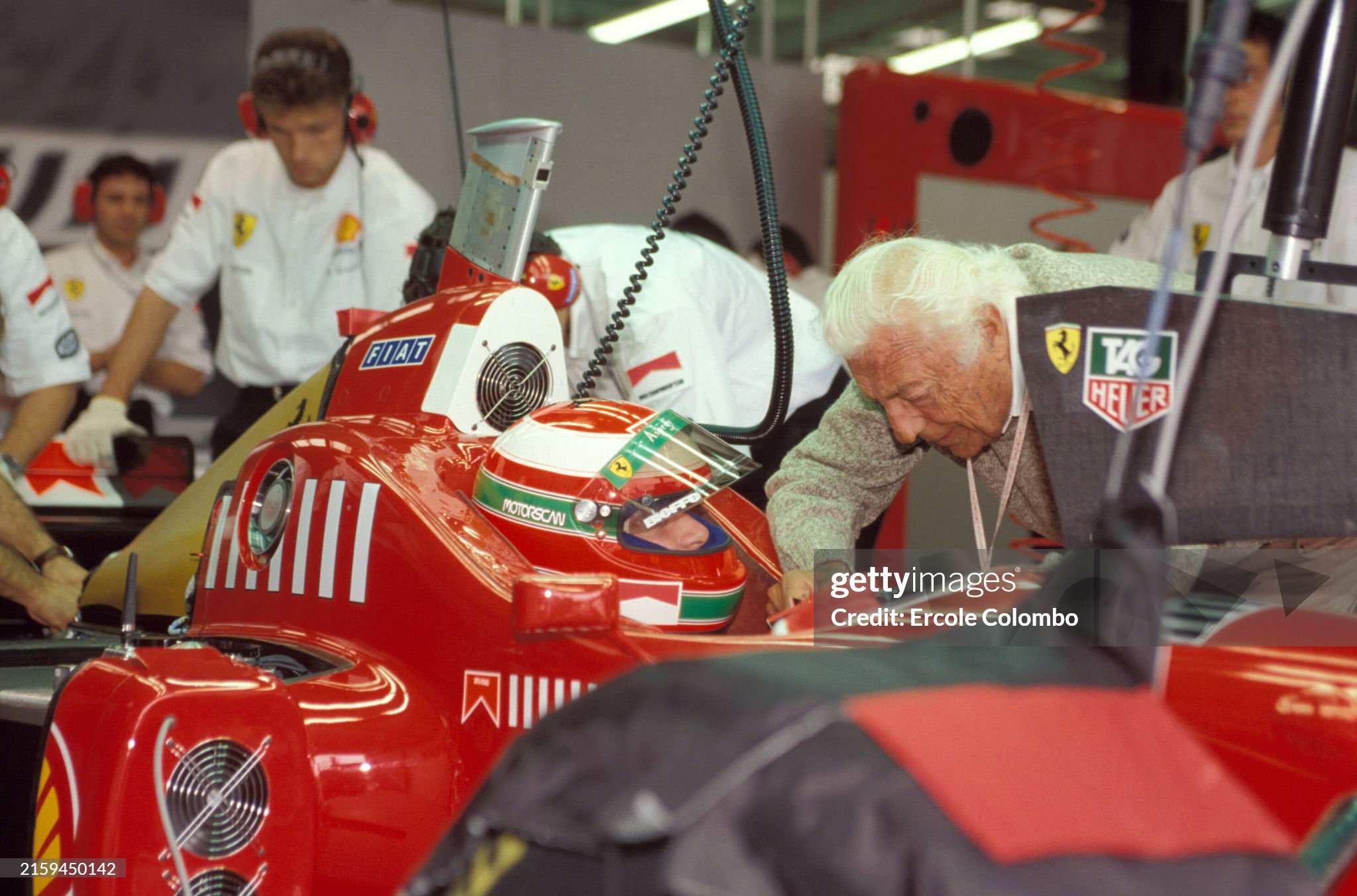Eddie Irvine, Ferrari F310, with Gianni Agnelli in the pits during the British Grand Prix at Silverstone on 14 July 1996. 