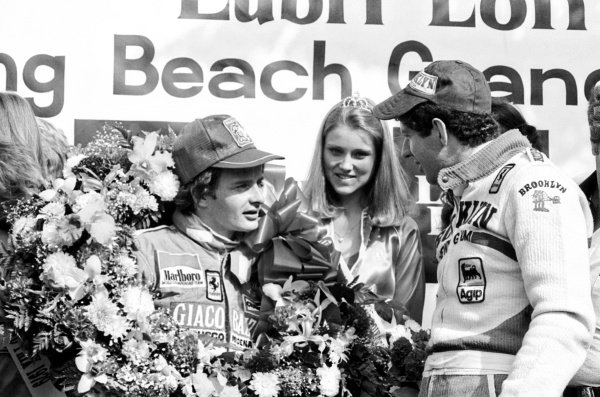 Winner Gilles Villeneuve on the podium with Jody Scheckter at Long Beach, USA, on 08 April 1979. 