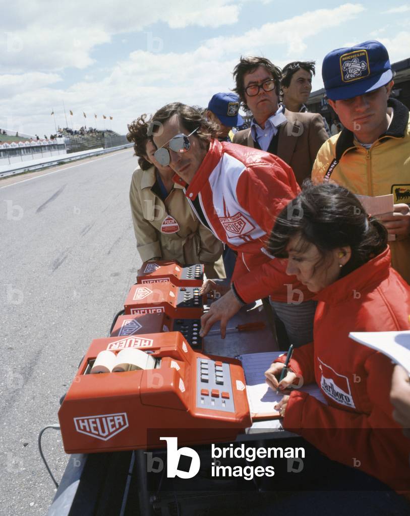 Ferrari timekeepers pit wall and Joann Villeneuve at the British Grand Prix in Silverstone, England, on 14 July 1979. 