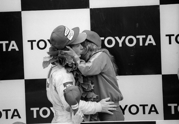 Race winner Gilles Villeneuve celebrates on the podium at the United States Grand Prix in Watkins Glen on 07 October 1979. 