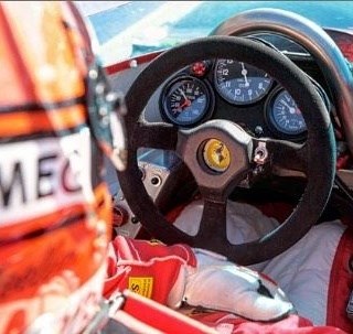 Gilles Villeneuve in his Ferrari 312's cockpit.