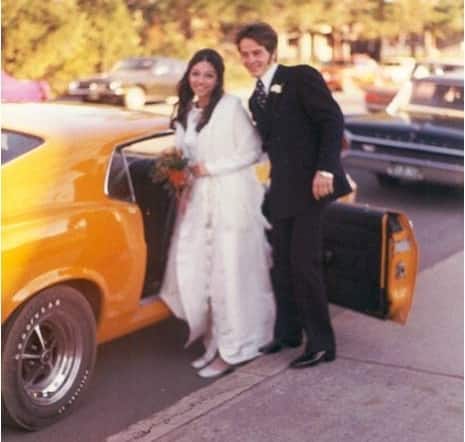 Gilles and Joann enter the Mustang on their wedding day.