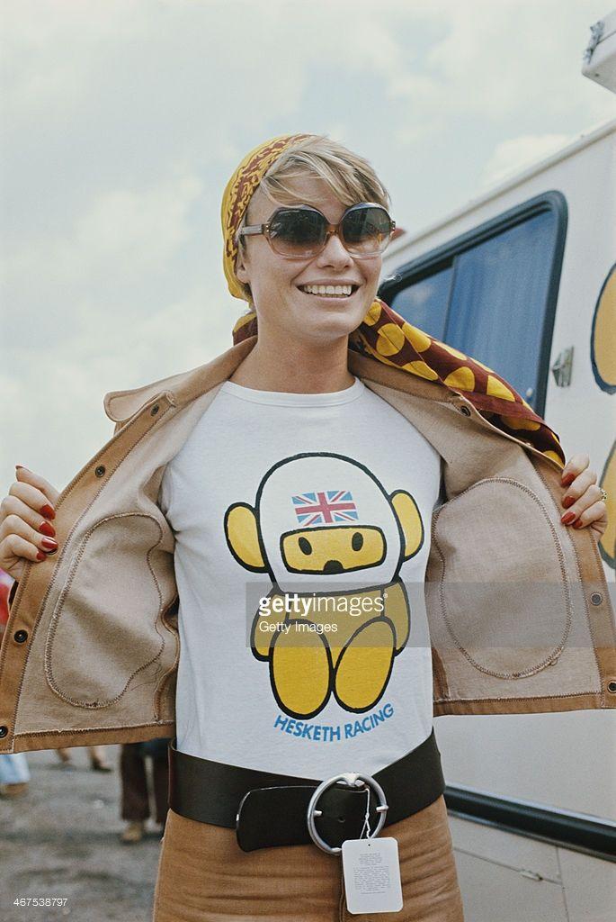 Suzy Miller, wife of James Hunt, driver of the Hesketh Racing Hesketh 308 Ford Cosworth DFV V8 shows her Hesketh Super Bear T shirt during the British Grand Prix on 20th July 1974 at the Brands Hatch circuit in Fawkham, Great Britain.