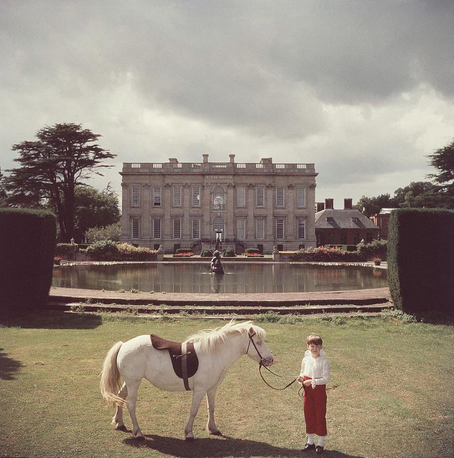 The youngest peer in England, seven year old Thomas Alexander Fermor-Hesketh, 3rd Baron and 10th Baronet Hesketh, with his pony 'Blossom' at his ancestral home, Easton Neston in Northamptonshire, in 1957.