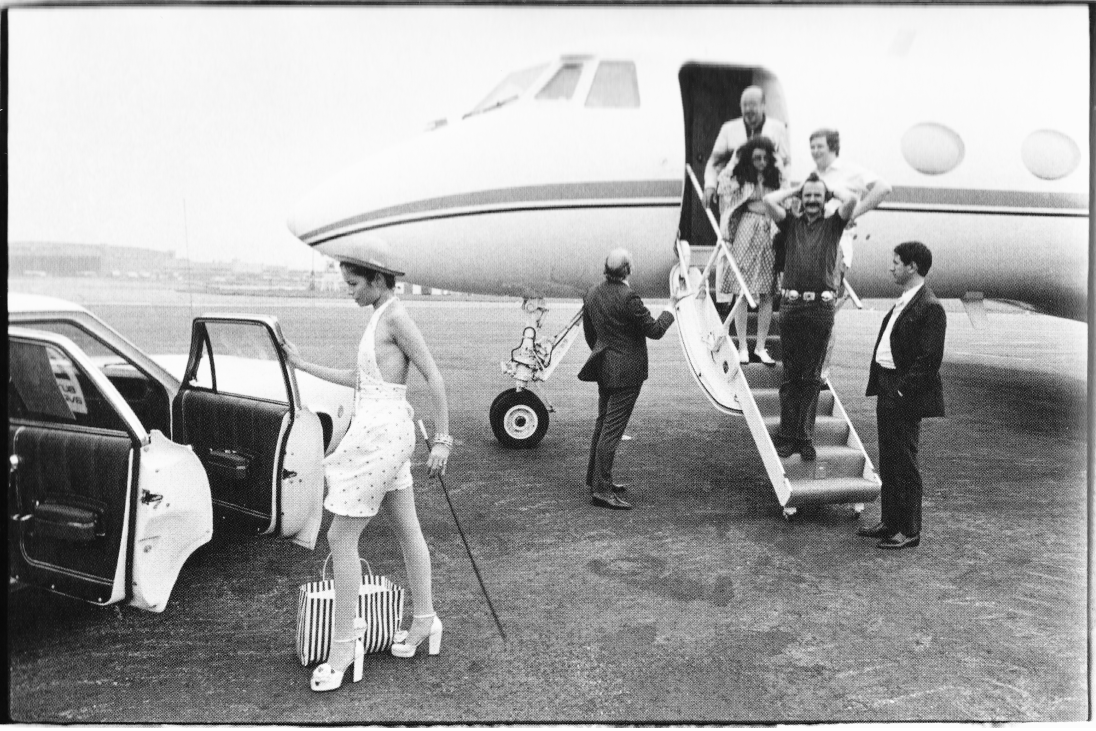 Lord Hesketh getting off his private plane with a girl.