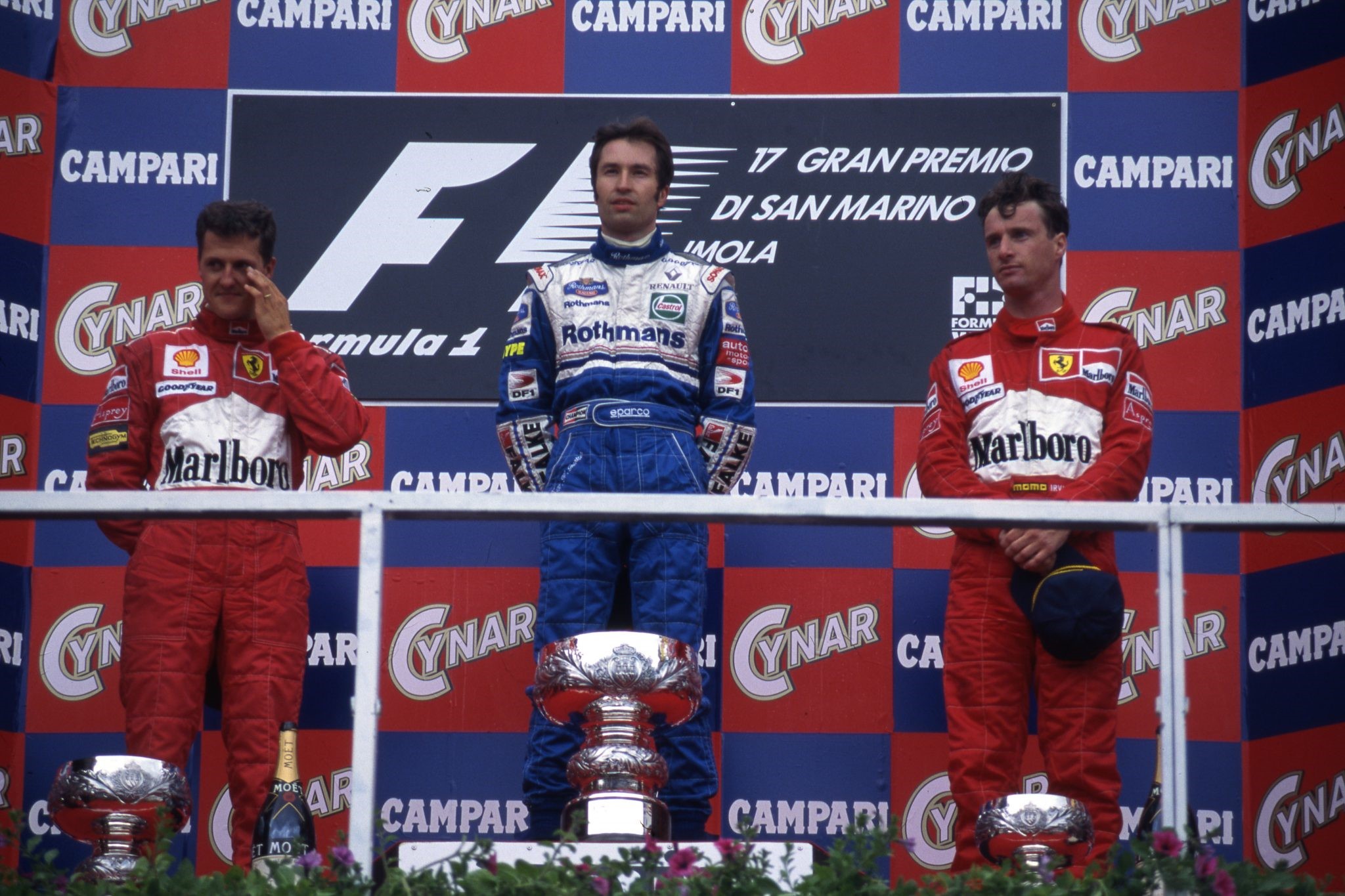 Michael Schumacher, Heinz-Harald Frentzen and Eddie Irvine on the podium at Imola.