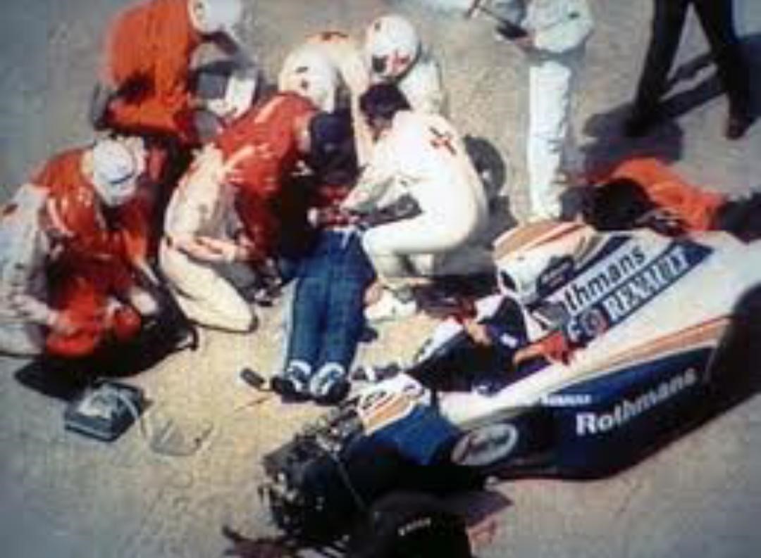 Ayrton Senna beside his car after the accident.
