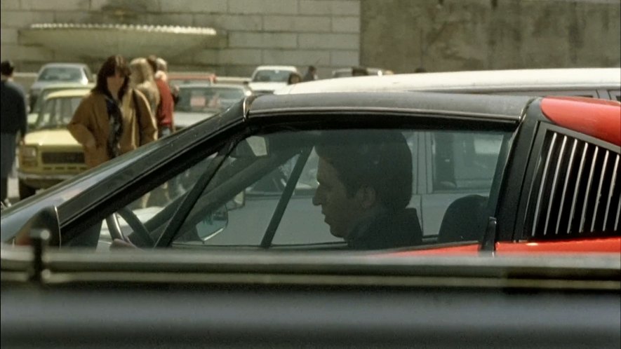 Dandi in his red Ferrari.