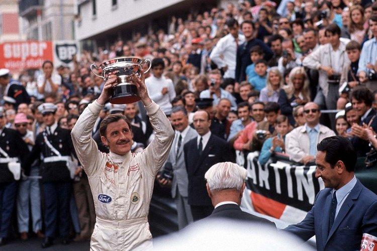 Graham Hill with a trophy.